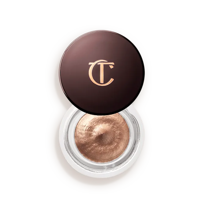 Metallic bronze cream eyeshadow in a round jar with brown lid featuring gold CT logo