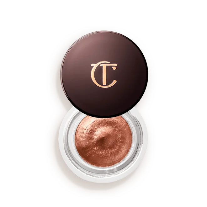 Shimmery bronze cream eyeshadow in a clear jar with dark brown lid and gold CT logo