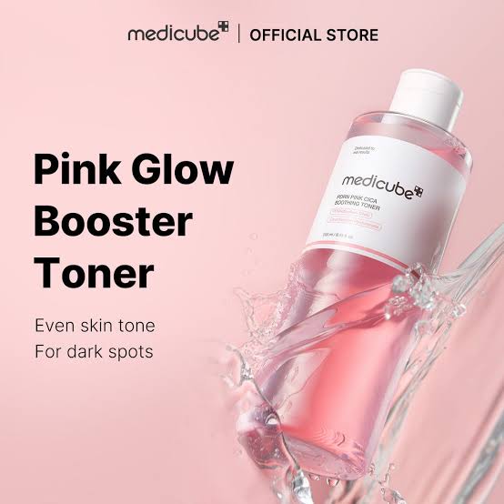 Medikube Pink Glow Booster Toner bottle with pink liquid on light pink background, skincare product for even skin tone and dark spots