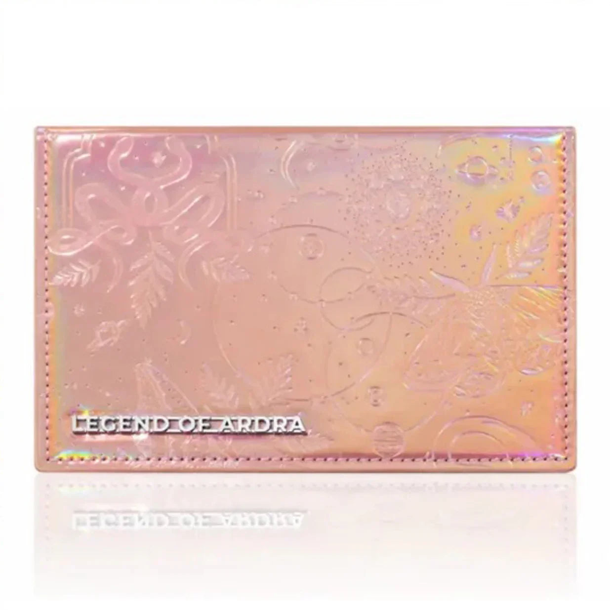 Iridescent pink makeup palette with embossed floral design and 'Legend of Ardra' text on cover